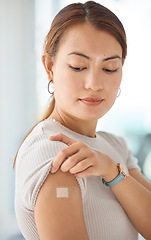 Image showing Healthcare, covid and vaccine with woman and bandaid on arm for medical, patient and wellness against virus. Medicine, support and health with girl after vaccination for sick, flu or illness