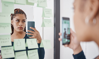 Image showing Sad, anxiety and woman at mirror with phone for pensive reflection photograph for social media. Depressed black girl with frustrated and unhappy face thinking of self esteem problem in distress.