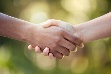 Image showing Community, handshake and support hand sign of diversity to show solidarity and trust. Welcome or greeting of hands together showing collaboration, partnership or deal agreement outdoors with bokeh