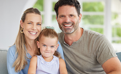 Image showing Happy portrait, family love and girl relax with mother and father on the living room sofa of house, smile for happiness in home and together in lounge. Face of parents with care for child on couch