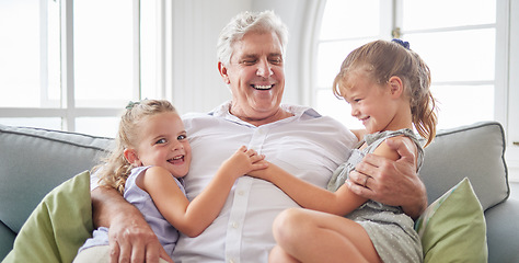 Image showing Happy family, retirement and old man playing with children on the sofa bonding, happiness and laughing together. Smile, elderly and grandpa with little girls enjoying quality time on a couch at home