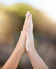 Image showing Women high five for support, teamwork and solidarity with bokeh outdoor sunshine or light. Motivation, success and goal achievement of couple winning hands gesture with love, care or working together