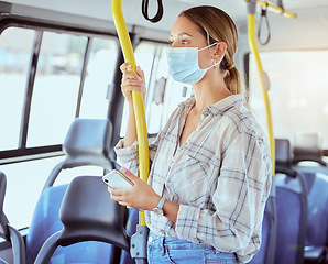 Image showing Covid, face mask and public transport with woman in a bus or train on commute into city or work during coronavirus pandemic. Travel, precaution and safety of commuter or passenger female traveling