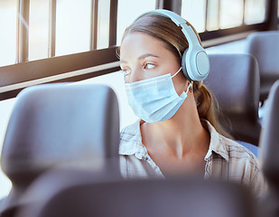 Image showing Covid face mask, headphones and woman on bus sad or worried while listening to podcast or music. Person travel in city train transportation with 5g and audio live streaming corona virus news update