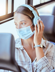 Image showing Covid, face mask or headphones on woman in bus for city travel, public transport or location commute. Thinking, fashion or relax student in virus compliance listening to podcast, radio or music audio