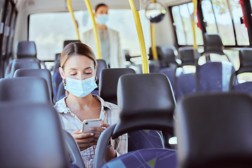 Image showing Covid, travel and phone social media with mask for illness prevention on public bus trip. Safety protocol girl face protection online with mobile app for transport leisure entertainment.