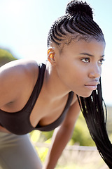 Image showing Motivation, focus and fitness black woman about to run a sport workout outdoor. Sports training, health exercise and athlete with a serious face expression about to start a strong cardio session