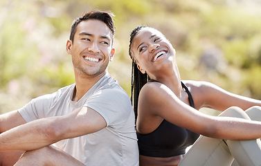 Image showing Couple rest after mountain hiking nature adventure, young black woman and Asian man relax together. A hike is good for fitness, a free way to see landscape and natural beauty of earth when traveling