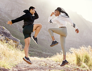 Image showing Fitness, nature and couple exercise in mountain hill, jump wellness and outdoor cardio workout on dust path. Motivation, health and sport partnership or friends in sports training or active lifestyle