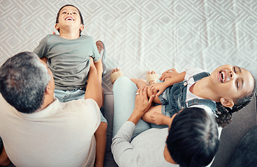 Image showing Family, children and grandparent laugh, happy and having fun on a sofa from above, playing in a living room.