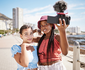 Image showing Live streaming holiday, beach travel and friends working on video podcast on international vacation in Miami, selfie with camera and summer content. African influencer women talking photo by the sea