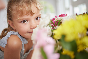 Image showing Flower smell and little girl in spring portrait with beautiful bouquet of fresh daisies aroma. Young child enjoying sweet and natural scent of bright floral garden petals in family home.