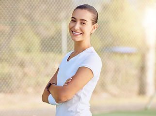 Image showing Fitness, sport and tennis with woman on court with arms crossed for game, training and exercise. Motivation, wellness and summer with happy girl in sports club for workout, health and empowerment