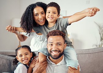 Image showing Mother, father and children in family portrait and bonding in house, home or hotel living room. Smile, happy and fun girl, boy or kids playing airplane game with man, mexican woman or parents on sofa