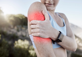 Image showing Sports injury, arm pain and a woman outside during exercise holding sore body muscle after fitness training and workout with glowing red anatomy. Runner female athlete sore and need arthritis relief