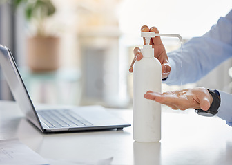 Image showing Covid, compliance and hand sanitizer with man cleaning hands before working on a laptop in a corporate office. Health, care and corona rules with professional entrepreneur disinfect workspace desk