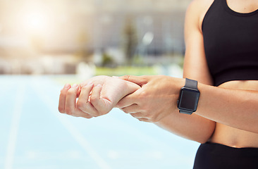 Image showing Health, progress and smartwatch with woman check pulse while sports training outdoor, cardio wellness. Fitness, heart and hand of runner monitor heart rate and beat, calorie tracking on a smart app