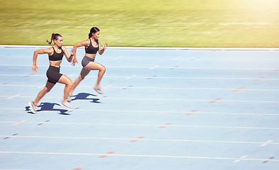 Image showing Sports, sprint runner women in competition on stadium with lens flare for power, speed and motivation. Professional athlete fitness people marathon running, training for goals, challenge and energy