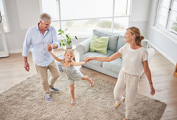 Image showing Family or grandparents dancing with child in living room for wellness, healthy body movement and growth development in retirement lifestyle. Happy energy, grandmother and grandfather dance with kid