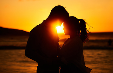 Image showing Silhouette couple, beach sunset and love outdoors on summer vacation, honeymoon travel and tropical holiday in Maldives. Shadow man, woman and ocean at dusk in nature, relax and calm valentines day