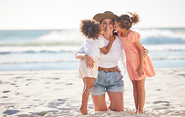 Image showing Mom, kiss or children bonding on beach in Portugal in trust, security or love hug. Smile, happy or support parent with girls, kids or family on relax holiday, mothers day or summer break by ocean sea