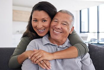 Image showing Retirement, love and hug with couple on sofa in together enjoying happy, relax and support. Smile, family and trust with portrait of man and woman sitting in living room for wellness, health or peace