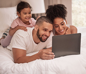 Image showing Brazilian family, laptop and girl bonding in house, home or hotel bedroom for movie streaming, zoom video call or social media show. Smile, happy and relax couple with child and multimedia technology