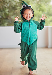 Image showing Creative, child and halloween costume by girl running in a crocodile suit, playing and laughing at home. Fantasy, happy and face of a kid excited to celebrate a fun festival, enjoying a break to play