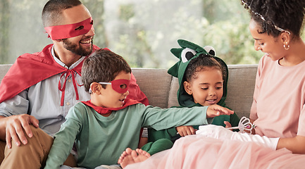 Image showing Family, children and halloween with kids and parents in costume while sitting on a sofa in the living room of their home. Love, imagination and celebration with a brother and sister dressing up