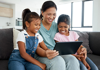 Image showing Happy mother and children with digital tablet watch funny videos, movies. or games on the home sofa. Family enjoy watching comedy cartoon with tech with online subscriptions in the living room