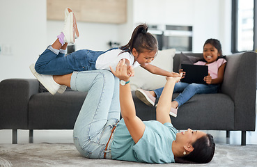 Image showing Family flying, helicopter game and mother being funny with children in house living room, care on the floor and smile for love in the lounge of home. Happy girl playing with her mom together