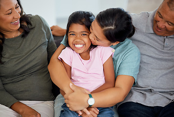 Image showing Portrait, girl with grandparents in living room as mother kiss and hug child on the sofa or couch. Latino family and young kid happy to enjoy bonding with old grandmother and man at home with love