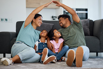 Image showing Happy family, floor and hands roof for safety, support and care or affection in home. Love, protection or house insurance symbol, caring parents and kids or girls sitting bonding in security together