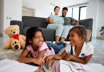 Image showing Happy little children drawing with parents in the background at home living room. Kids enjoying quality time and creative art together while man and woman babysitting children in the living room