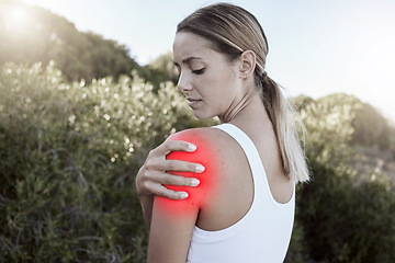 Image showing Fitness, woman and shoulder injury, pain or joint inflammation holding sore area in nature outdoors. Injured female suffering in painful muscle tension from training, workout or exercise accident