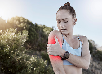 Image showing Woman, fitness and arm injury, muscle tension or joint inflammation holding painful area in nature. Injured fit female in pain from training, workout or exercise accident touching sore arms in strain