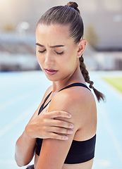 Image showing Woman athlete hands shoulder pain, emergency health risk and muscle strain during workout, training and exercise. Closeup of female runner touching pulled muscle, arm injury and sore outside on track