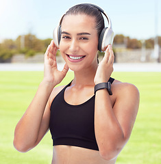 Image showing Exercise, podcast and radio with woman listen to music while exercising at a park, happy and relax. Fitness, health and portrait of a girl enjoy motivation and wellness tips, audiobook and workout
