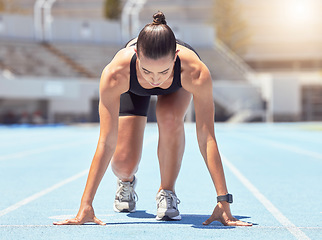 Image showing Motivation, energy and runner start training at outdoor track, ready to practice go. Health, power and fitness goal by professional woman athlete with strong mindset prepare for speed, cardio sprint