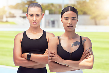 Image showing Women, athlete and focus at training ground or running club together. Confidence, arms crossed and girl teamwork at sports field or fitness facility to prepare for competition or contest