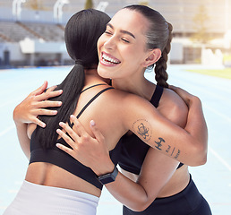 Image showing Friends hug and smile for congratulations, running or exercising outdoors on racetrack. Woman, support and winner, happy during summer workout for motivation and success, run for fitness and health