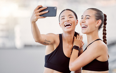 Image showing Phone selfie, laughing and fitness women live streaming workout, exercise or training in gym. Smile, happy or sports health influencer friends with wellness motivation in social media tech photograph