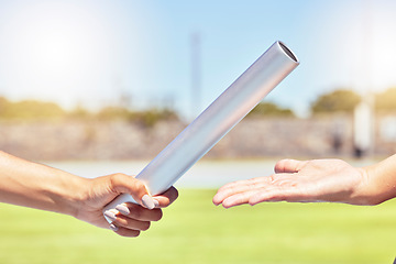 Image showing Teamwork, sports and hands of runner with relay race with baton in field stadium event for health, training or fitness. Partnership, goal and support with athlete running in exercise or competition