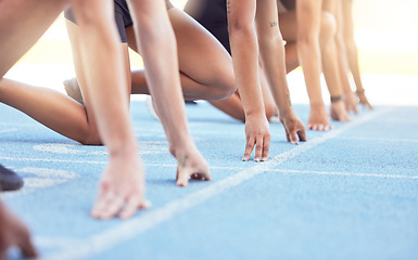 Image showing Runners with hands on start line on the track for a race, ready to run. Racing challenge or sprint at sports event with closeup for motivation, concentrate and focus in athletes running on track
