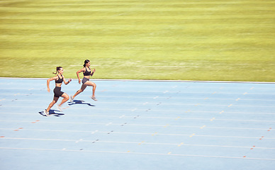 Image showing Mockup space, runner and woman exercise, training and running on track for race. Health, female athletes and runners workout, sprinting and competing on race course, field and arena in sportswear.