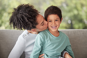 Image showing Happy family, love and mother kiss son on a sofa, smile and relax in a living room together. Children, care and parent embracing child, happy and loving while enjoying motherhood with her sweet kid