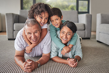 Image showing Grandparents, children or bonding in fun play game on house or family home living room floor. Portrait, smile or happy senior man and mature woman babysitting grandchildren or kids together in lounge