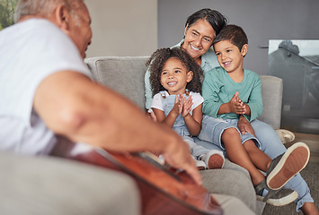 Image showing Grandparents, children and clapping for guitar music on house or home living room sofa. Smile, happy or bonding kids with retirement woman and elderly senior man listening to creative family musician