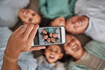 Image showing Family selfie, phone face and hand of man with technology with grandparents and children, smile while relax and happy on living room floor. Parents, kids and elderly people taking photo on tech