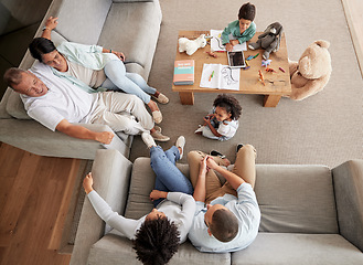 Image showing Big family, talking and bonding during visit and sitting on sofa in lounge with children, parents and grandparents. Love, happiness and guest or multi generation people together to relax and have fun